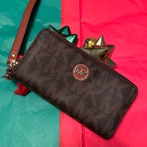 Michael Kors wallet size wristlet.